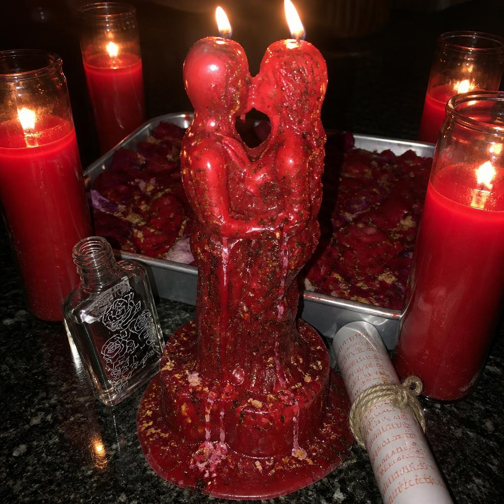 Handcrafted love return spell candle working with joined lovers figure candle, honey jar, roses and herbs.